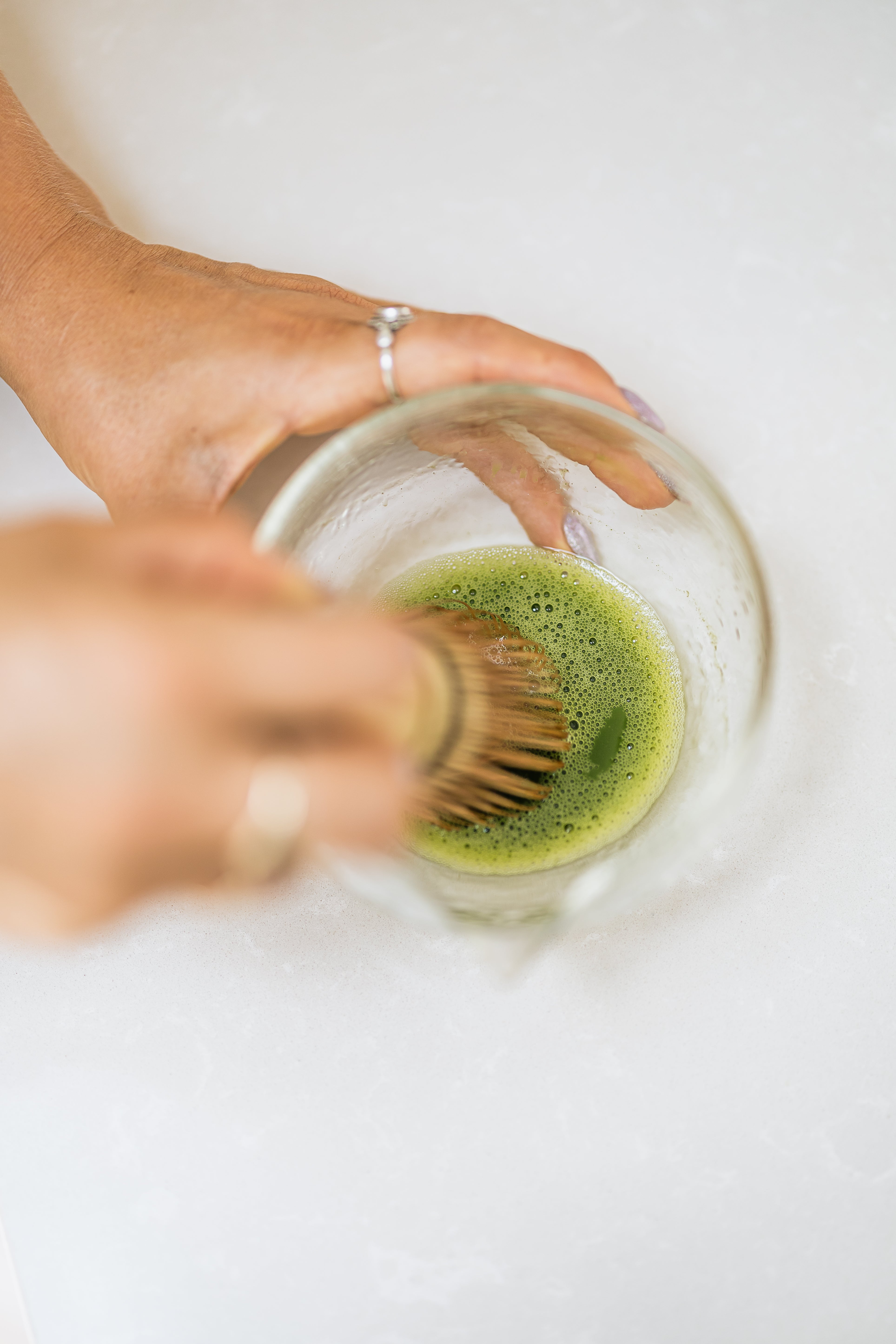 Whisking matcha in a glass bowl without a bamboo whisk - Nurtur Tea